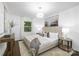 Serene main bedroom with neutral colors, a chandelier and lots of natural light at 4017 Sulkirk Rd, Charlotte, NC 28210
