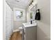 Bathroom features a new vanity with modern faucet and a shower/tub with neutral colored shower curtain at 403 W 2Nd St, Cherryville, NC 28021