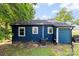 Rear exterior of home featuring a clean blue facade and well-maintained windows at 403 W 2Nd St, Cherryville, NC 28021