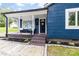 Inviting front porch with seating area and landscaped front yard at 403 W 2Nd St, Cherryville, NC 28021