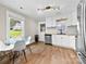 Bright kitchen with butcher block countertops, white cabinets, and new appliances at 403 W 2Nd St, Cherryville, NC 28021