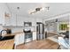 Bright kitchen showcases white cabinets, stainless steel appliances, butcher block counters and modern track lighting at 403 W 2Nd St, Cherryville, NC 28021