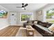 Living room with a ceiling fan and a large sectional sofa at 403 W 2Nd St, Cherryville, NC 28021