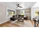 Bright living room with hardwood floors, a ceiling fan, and lots of natural light at 403 W 2Nd St, Cherryville, NC 28021