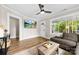 Bright living room with a ceiling fan, hardwood floors and a view to the outdoors at 403 W 2Nd St, Cherryville, NC 28021