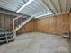 Unfinished basement area with exposed beams and staircase at 407 S Buckoak St, Stanley, NC 28164