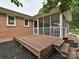Exterior shot showcasing a spacious wooden deck accessible from the house, perfect for outdoor living at 407 S Buckoak St, Stanley, NC 28164