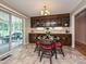 Dining area with table and chairs near sliding door, complete with beautiful wooden cabinetry at 407 S Buckoak St, Stanley, NC 28164