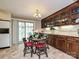 Charming dining room featuring a table set for four with a sliding glass door to the backyard at 407 S Buckoak St, Stanley, NC 28164