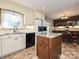 Charming kitchen with an island, granite countertops, and stainless steel appliances at 407 S Buckoak St, Stanley, NC 28164