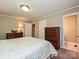Cozy main bedroom featuring a queen-sized bed, bedside tables, and plenty of closet space at 407 S Buckoak St, Stanley, NC 28164