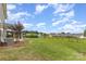 A spacious backyard with a black fence and green lawn, great for outdoor enjoyment at 463 Hunton Forest Nw Dr, Concord, NC 28027