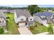 Charming home with a well-manicured lawn, covered porch, attached garage and tasteful stone accents at 463 Hunton Forest Nw Dr, Concord, NC 28027