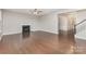 Spacious living room with a cozy fireplace, hardwood floors, and plenty of natural light at 463 Hunton Forest Nw Dr, Concord, NC 28027