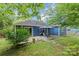 Expansive backyard with a patio dining area, lush greenery, and a well-maintained lawn, ideal for outdoor living at 4810 Shea Ct, Monroe, NC 28110