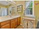 Bathroom featuring a decorative vanity, neutral walls, shelving, and a window at 4810 Shea Ct, Monroe, NC 28110