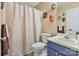 Bathroom featuring a shower with a curtain, a toilet, and a blue vanity at 4810 Shea Ct, Monroe, NC 28110