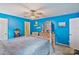 Bright bedroom featuring a four-poster bed, natural wood dresser, and charming decor at 4810 Shea Ct, Monroe, NC 28110