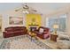 Comfortable living room with warm colors, a fireplace, and ample seating for relaxation and entertainment at 4810 Shea Ct, Monroe, NC 28110