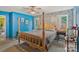 Inviting primary bedroom with natural light, a four-poster bed, and calming blue accents at 4810 Shea Ct, Monroe, NC 28110