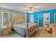 Serene bedroom with a wooden four-poster bed, soft lighting, and peaceful decor at 4810 Shea Ct, Monroe, NC 28110