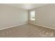 Cozy bedroom featuring neutral paint and plush carpeting at 4912 Grace View Dr, Pineville, NC 28134