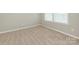 Bright bedroom featuring neutral paint and plush carpeting at 4912 Grace View Dr, Pineville, NC 28134