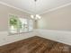 Dining room with elegant molding, a chandelier, and bright windows, perfect for Gathering gatherings at 4912 Grace View Dr, Pineville, NC 28134