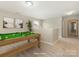Upstairs game room with pool table, neutral carpet, and lots of light at 4912 Grace View Dr, Pineville, NC 28134