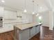 Bright kitchen features granite countertops, modern appliances, and a large island with a sink at 4912 Grace View Dr, Pineville, NC 28134