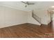 Living room with decorative wall trim, ceiling fan, and hardwood floors at 4912 Grace View Dr, Pineville, NC 28134
