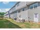 Backyard featuring a patio with a grill, outdoor seating, and grass at 5023 Daybell St, Charlotte, NC 28214