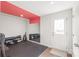 Spacious finished basement with rubber flooring, a mirror, and workout equipment at 5023 Daybell St, Charlotte, NC 28214