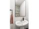 Powder room features floral wallpaper and updated fixtures at 5023 Daybell St, Charlotte, NC 28214