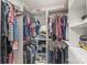 Walk-in closet with organized shelving and hanging storage at 5023 Daybell St, Charlotte, NC 28214