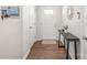 Inviting entryway with hardwood floors, a console table, and a decorative mirror at 5023 Daybell St, Charlotte, NC 28214