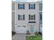 Charming two-story townhome with a one car garage and light blue door at 5023 Daybell St, Charlotte, NC 28214