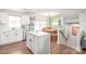 Bright kitchen with island opens up into the dining area at 5023 Daybell St, Charlotte, NC 28214