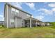 Spacious backyard featuring a screened patio and pergola, perfect for outdoor entertaining at 5043 Baileys Run Dr, Rock Hill, SC 29732
