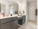 Bathroom featuring dual sinks, a large mirror, and modern cabinets at 5043 Baileys Run Dr, Rock Hill, SC 29732