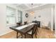 Elegant dining room features a chandelier, coffered ceiling, and large windows at 5043 Baileys Run Dr, Rock Hill, SC 29732
