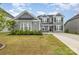 Attractive two-story home featuring manicured lawn and a welcoming facade at 5043 Baileys Run Dr, Rock Hill, SC 29732