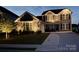 Charming two-story home with landscaped yard illuminated in the evening at 5043 Baileys Run Dr, Rock Hill, SC 29732