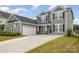 Beautiful two-story home with a spacious driveway and well-maintained lawn at 5043 Baileys Run Dr, Rock Hill, SC 29732