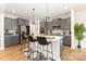 Beautiful kitchen with stainless steel appliances, an island with bar seating, and gray cabinetry at 5043 Baileys Run Dr, Rock Hill, SC 29732