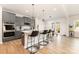 Modern kitchen featuring an island with seating, stainless appliances, and access to the dining area at 5043 Baileys Run Dr, Rock Hill, SC 29732