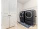Laundry room with washer and dryer and folding door closet space at 5043 Baileys Run Dr, Rock Hill, SC 29732