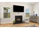 Bright living room featuring a fireplace, hardwood floors, and ample natural light at 5043 Baileys Run Dr, Rock Hill, SC 29732