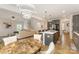 Open concept living space with a stylish dining area and modern kitchen at 5043 Baileys Run Dr, Rock Hill, SC 29732