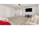 Spacious entertainment room with a large TV, plush carpeting, and comfortable seating at 5043 Baileys Run Dr, Rock Hill, SC 29732